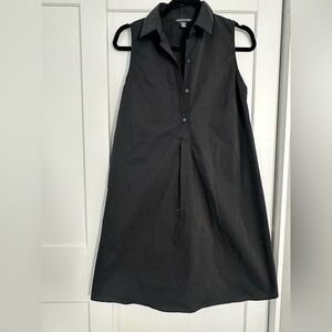 Cute black dress. Small spot as shown in the photos.